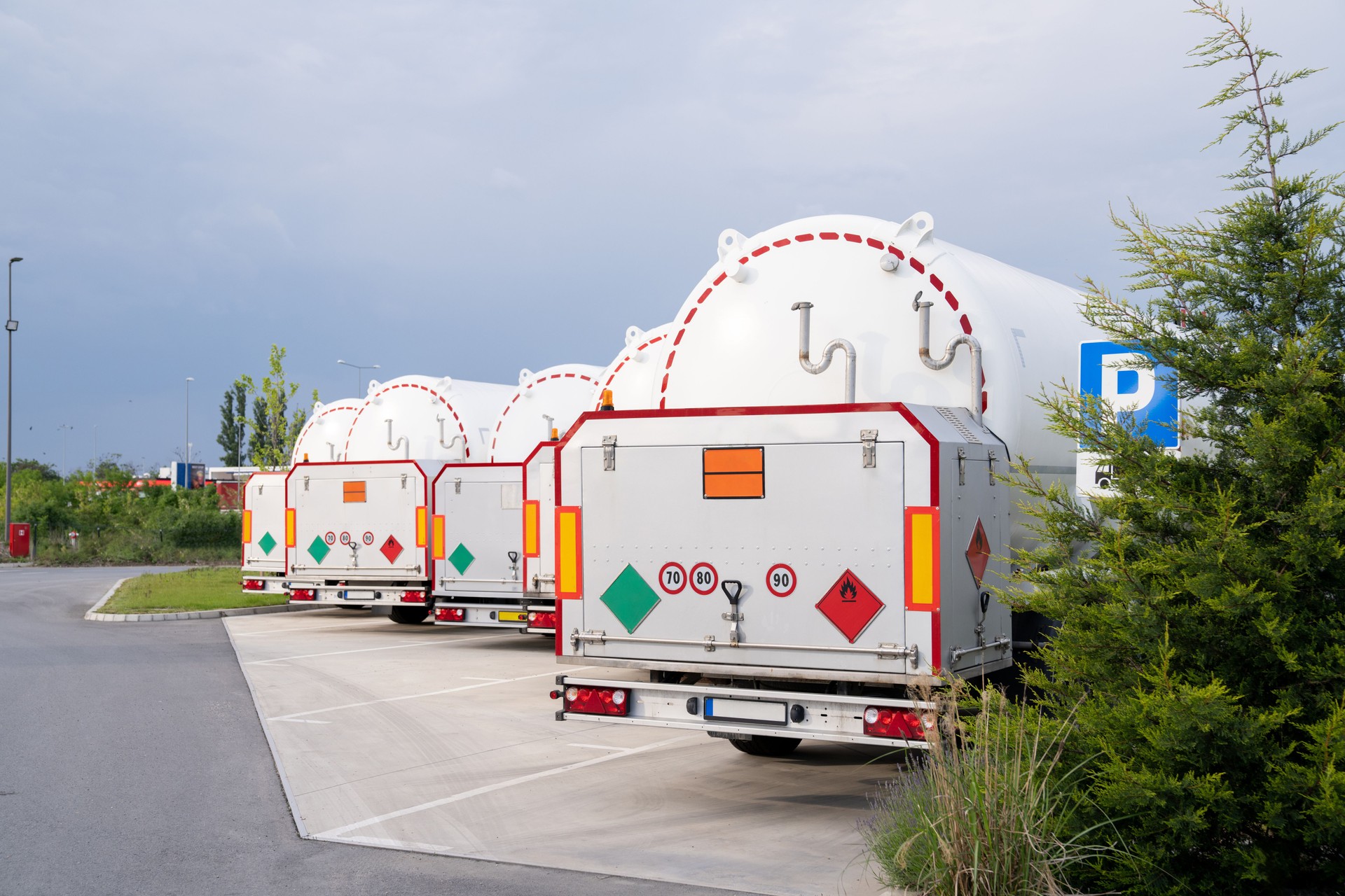 Tank trailers stand in a row.